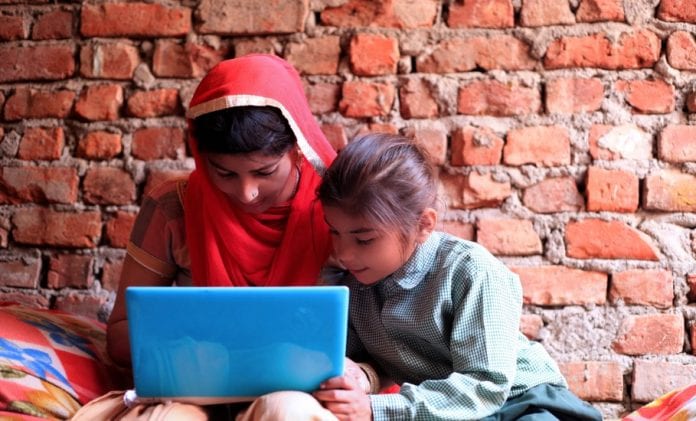 indian-women-using-laptop-at-home-picture-id804145938-696×421-1